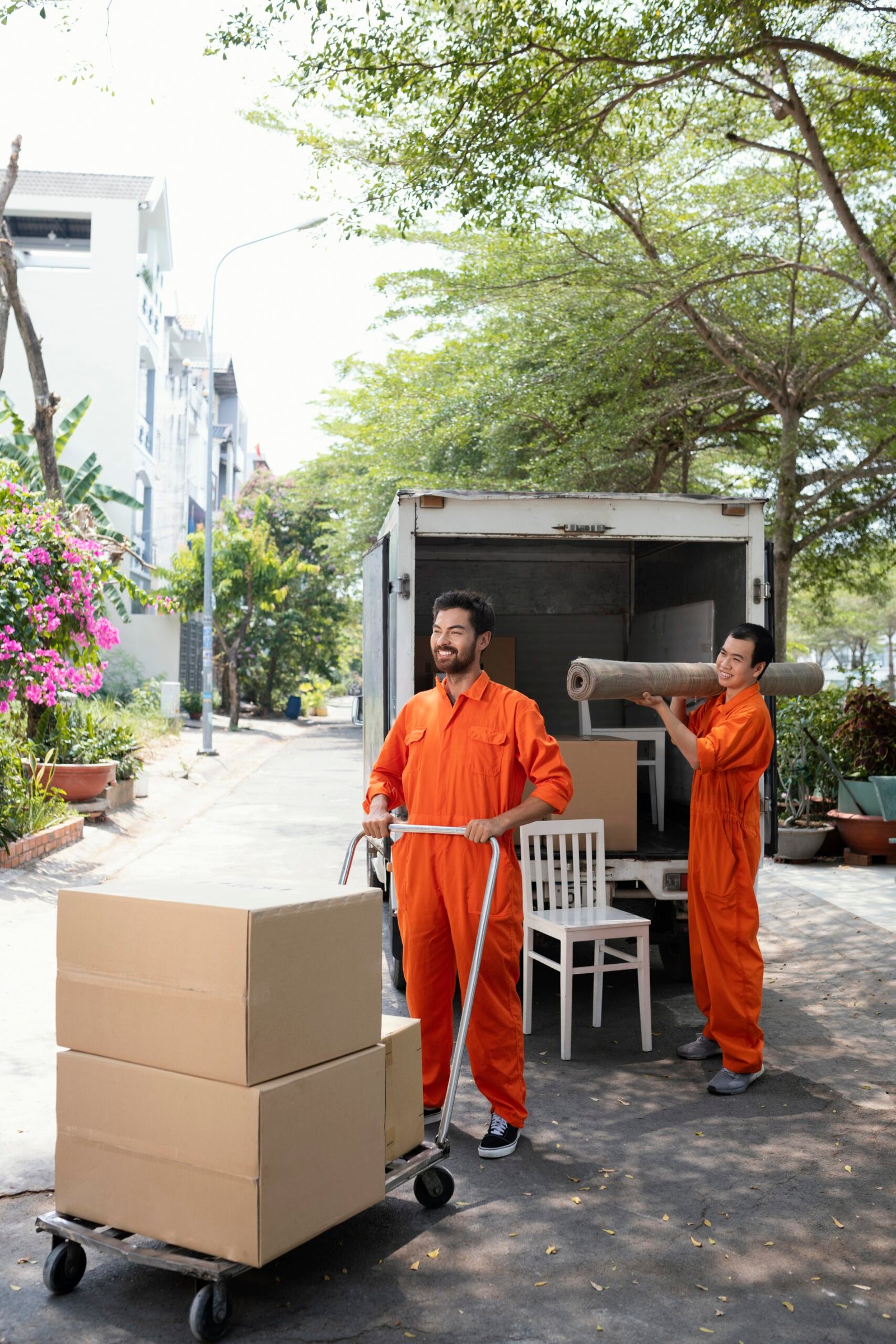 vertical-shot-young-delivery-men-moving-objects-out-car vertical-shot-young-delivery-men-moving-objects-out-car